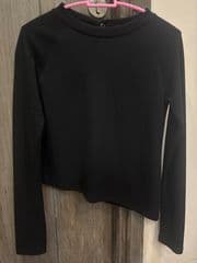 Black long-sleeved shirt - image blurred placeholder