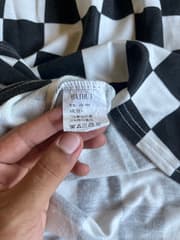 เสื้อโปโล ลายตารางหมากรุก - image blurred placeholder