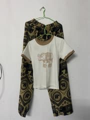 Set with a white elephant-print shirt and brown elephant-print long pants - image blurred placeholder