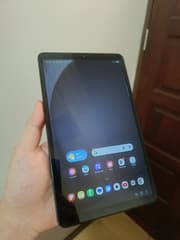 Samsung Tab A9, 4GB RAM, 64GB ROM, good condition, used, includes case, screen protector, and charging cable - image blurred placeholder
